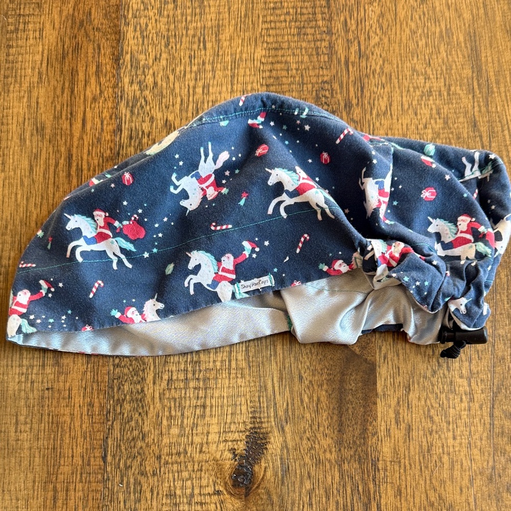Santa riding a unicorn surgical scrub cap